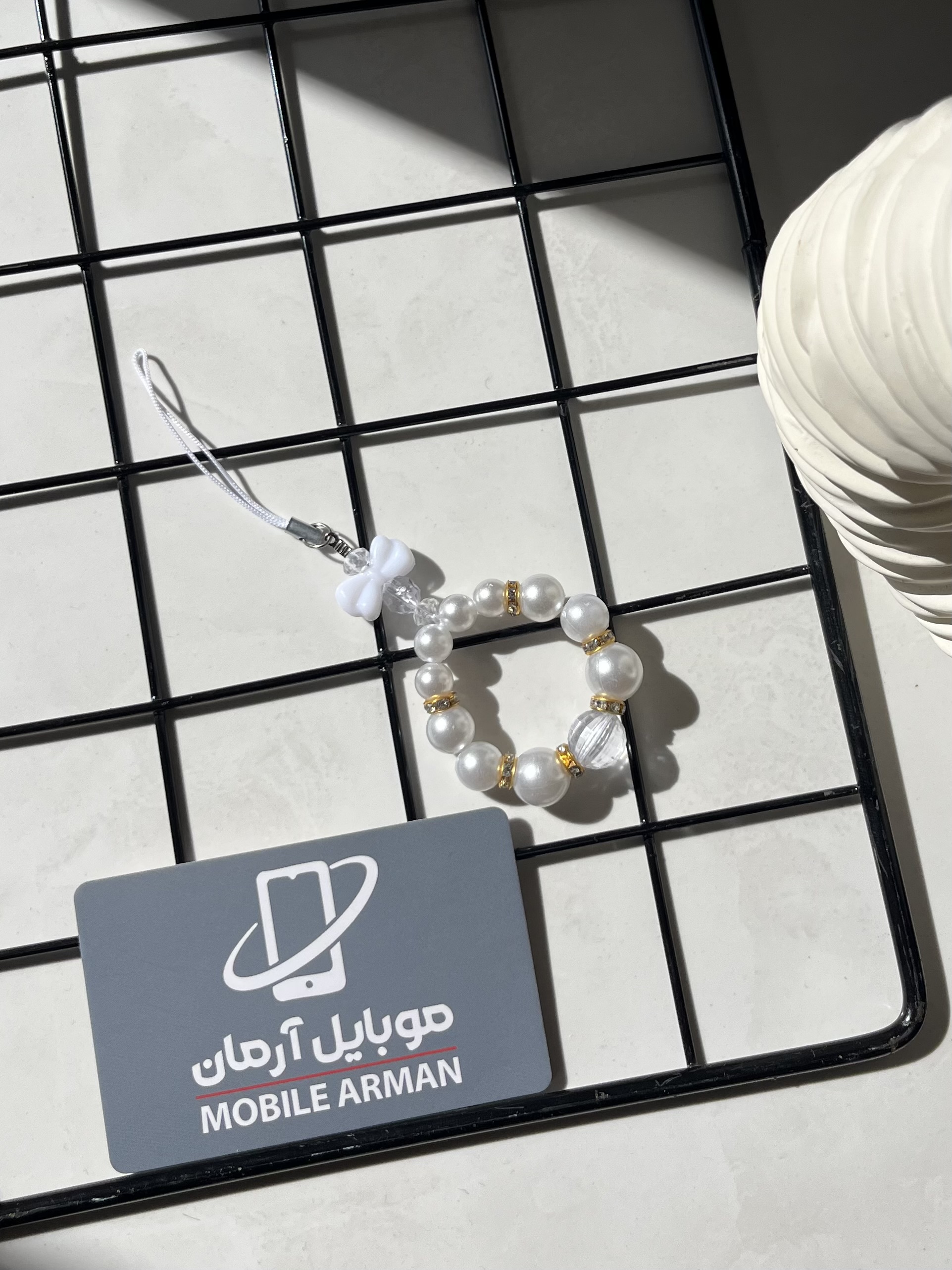 آویز گوشی فانتزی مروارید و پاپیون سفید